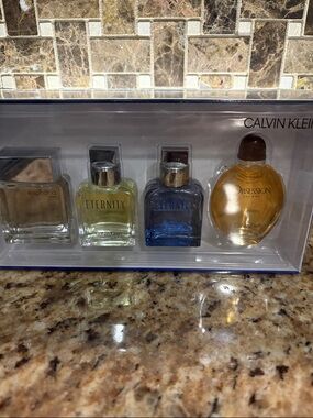 Calvin Klein Men's Mini Cologne Quartet - Amber, Blue, Pale Yellow, Clear